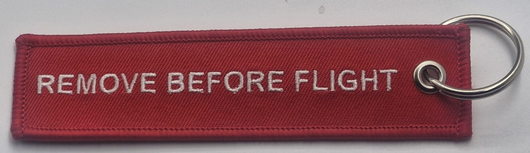 הסר לפני טיסה REMOVE BEFORE FLIGHT מחזיק מפתחות